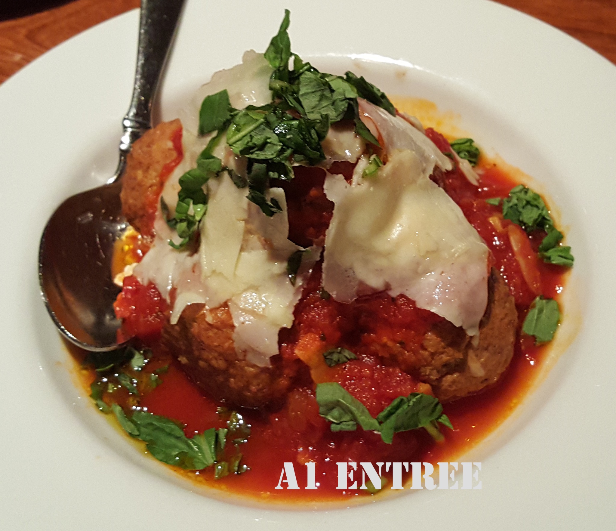 Italian meatball with tomato sauce, cheese, and basil