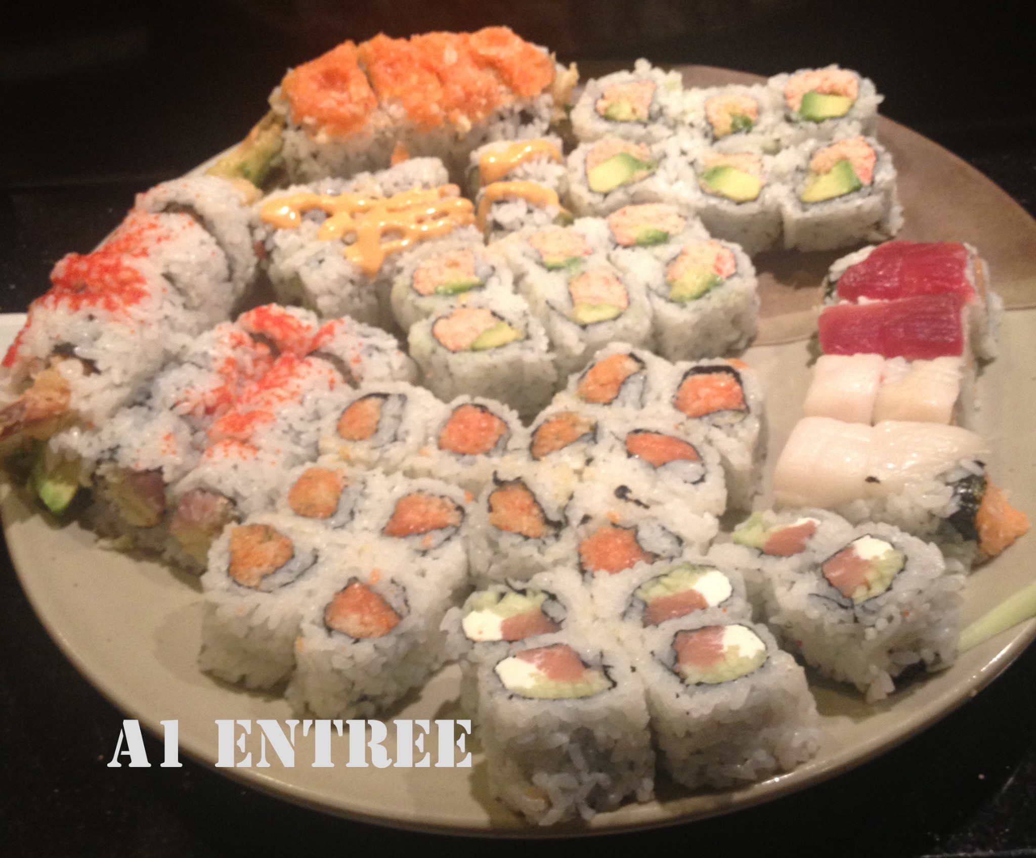 Sushi platter with multiple rolls and pieces of nigiri